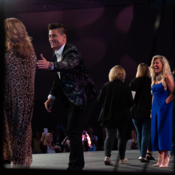Convention-Photography Participants enjoying a celebratory moment on stage at the Pasadena Convention Center, photographed by Coldea Productions.