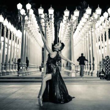 Ballet dancer posing elegantly at LACMA's "Urban Light" installation, photographed by Coldea Productions