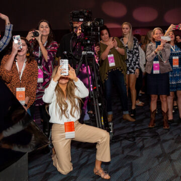 Convention-Photography Audience members capturing photos and videos of the Modere Platinum award celebration at Anaheim Convention Center, highlighting the excitement and engagement, photographed by Coldea Productions