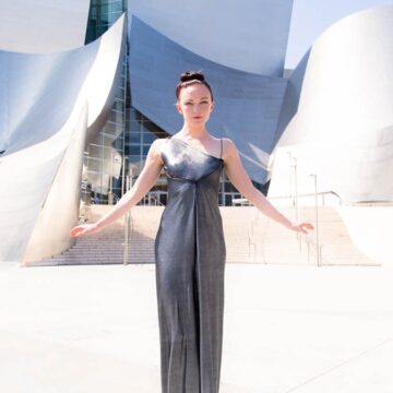 Fashion model in an elegant gown posing in front of the Walt Disney Concert Hall in Los Angeles, showcasing Coldea Productions' fashion and portrait photography