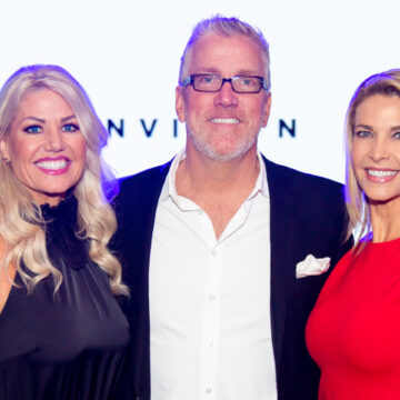 Conference-Photography Scentsy representatives smiling on stage at the Envision 20/20 conference, captured by Coldea Productions, highlighting corporate event photography.