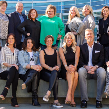 Conference-Photography The Scentsy Team posing in front of the Anaheim Convention Center, captured by Coldea Productions, highlighting a corporate team gathering.