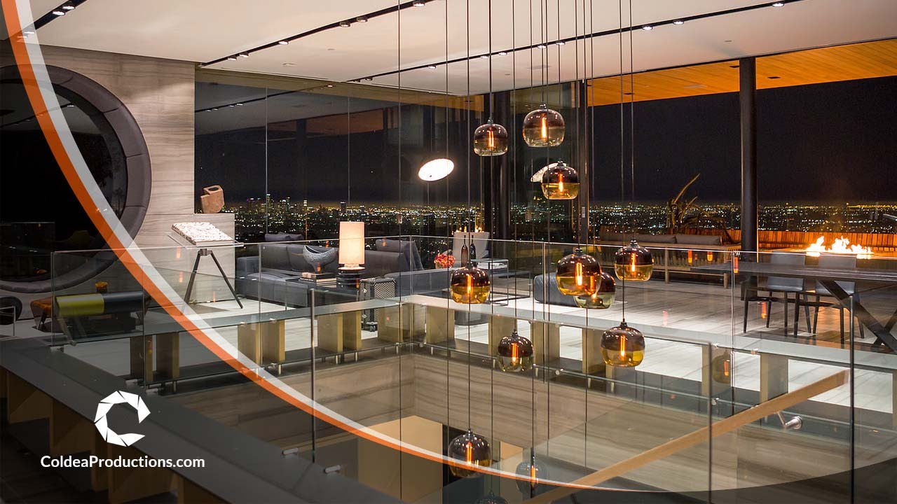 Modern luxury living room with city view, showcasing ambient lighting and glass architecture in a real estate video presentation by Coldea Productions.