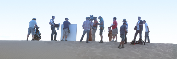 A professional video production crew working on location in a desert setting, representing Coldea Productions' expertise as a full-service video production company.