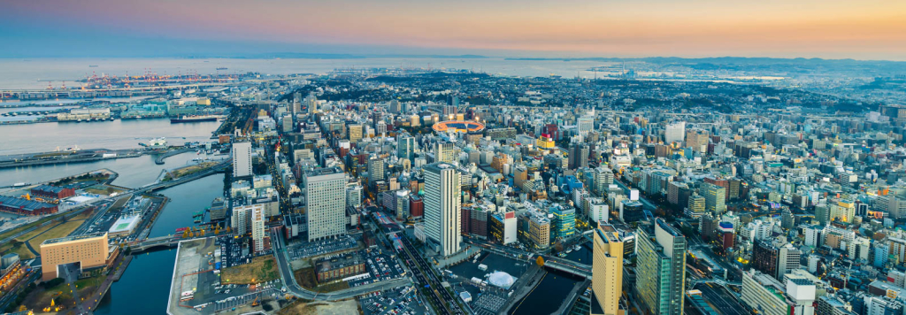 Aerial view of a vibrant cityscape at sunset, ideal for nationwide photography services by Coldea Productions.