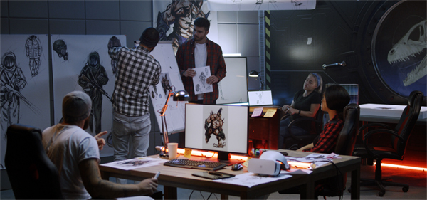 Creative team working on animation character designs in a studio, showcasing the benefits of animation videos for business growth