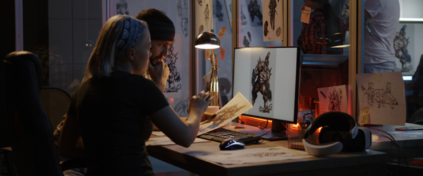 Two animators collaborating on character design at a workstation, symbolizing Coldea Productions' expertise in animated video production.