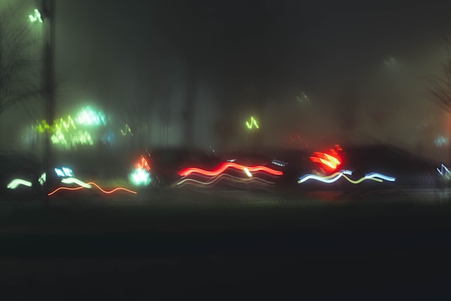 Blurry night photo with streaks of light symbolizing the impact of poor-quality and amateur photography on brand credibility, created by Coldea Productions.