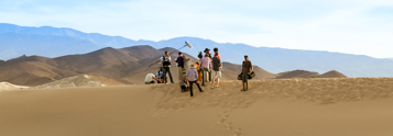 Film crew shooting a video commercial in a desert location with Coldea Productions.