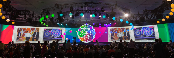 Vibrant exposition setup with colorful lighting and audience, expertly photographed by Coldea Productions, nationwide exposition photography specialists.