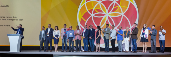 Coldea Productions captures a corporate awards ceremony with honorees on stage.