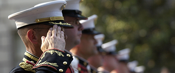 Military officers in formal uniform saluting, ideal for military recruiting video content.