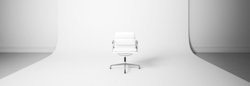 Minimalist white chair in a professional photography studio setup, representing Coldea Productions' nationwide product photography services.