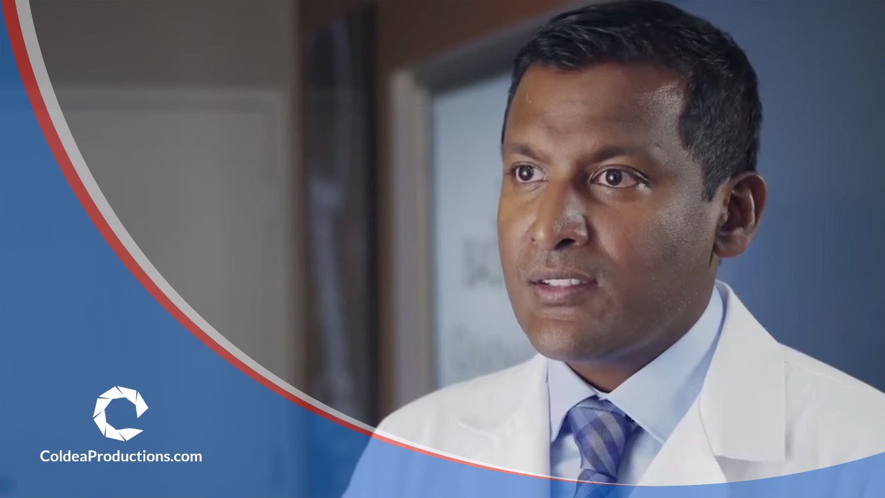 Doctor presenting in a medical video, discussing healthcare solutions, produced by Coldea Productions.