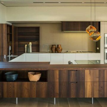 Modern kitchen interior with wooden cabinetry and stylish decor, photographed by Coldea Productions for real estate marketing