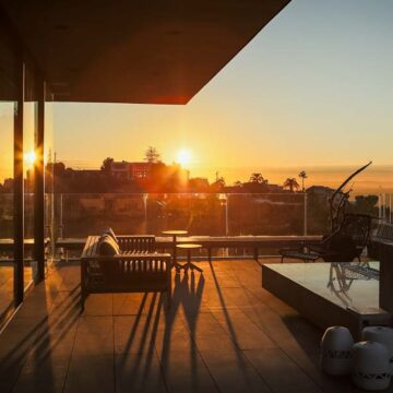 Modern terrace with a panoramic sunset view over Los Angeles, captured by Coldea Productions