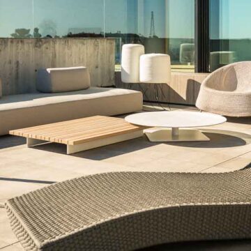 Modern outdoor lounge area with stylish furniture and scenic views, captured by Coldea Productions for real estate marketing.
