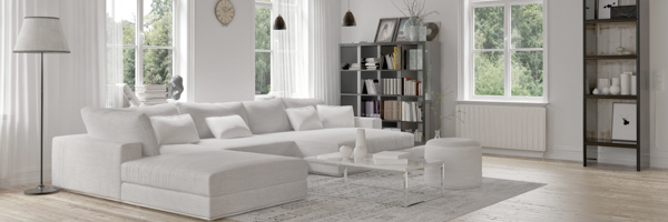 A modern, bright living room interior with large windows, representing Coldea Productions' expertise in creating real estate videos to showcase properties.