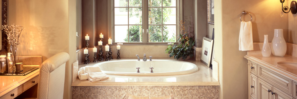 A luxurious bathroom with a centerpiece bathtub surrounded by elegant decor, representing Coldea Productions' expertise in real estate video production.