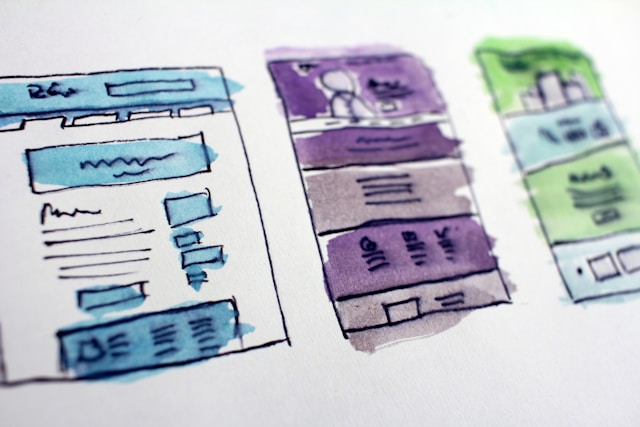 Top Video Marketing Trends in 2024 Hand-drawn website wireframes representing the planning and design process for web development and video marketing strategies.