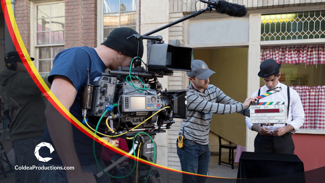 Crew working on the set of the short film Believe (2014), directed by Jose Rodriguez-Robles, with a cameraman and clapperboard operator preparing a shot.