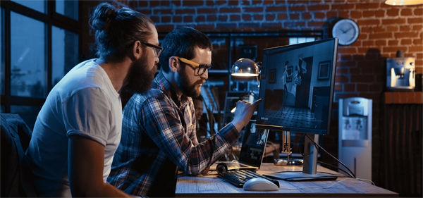 Coldea Productions animation team reviewing a project on a computer screen, showcasing their expertise in video animation services.