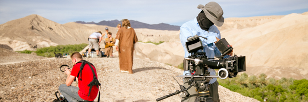 Outdoor film crew working on a video production set in a desert landscape, part of Coldea Productions' services in Riverside, California