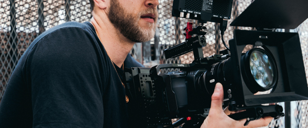 Professional video editing setup with colorful backlit keyboard, ideal for video production services for production companies in Arizona, by Coldea Productions.