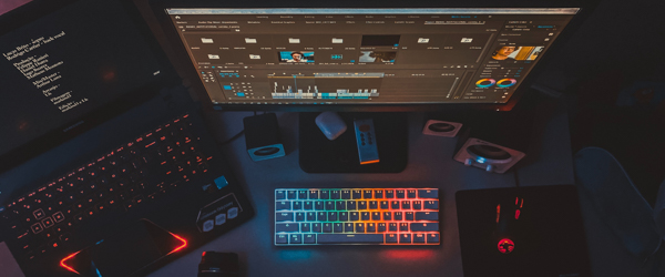 Professional video editing setup with colorful backlit keyboard, ideal for video production services for production companies in Arizona, by Coldea Productions.