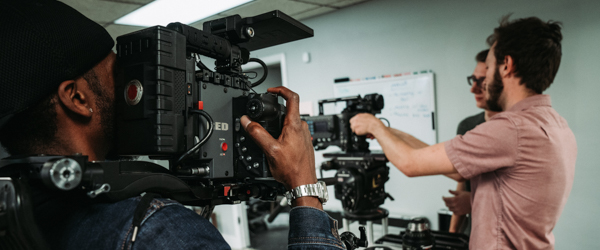 Camera crew collaborating on a video project in a professional setting, ideal for video production services in Scottsdale, Arizona, by Coldea Productions.